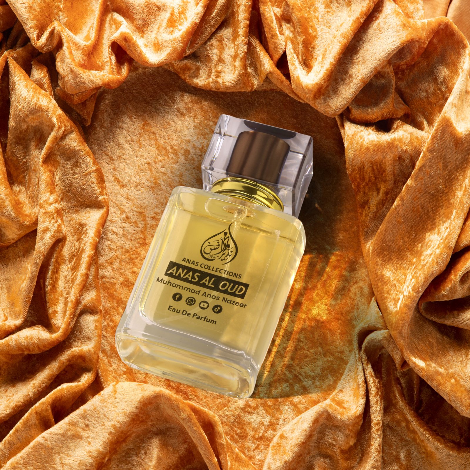 Angled product shot of Anas Al Oud premium fragrance bottle featuring golden branding.