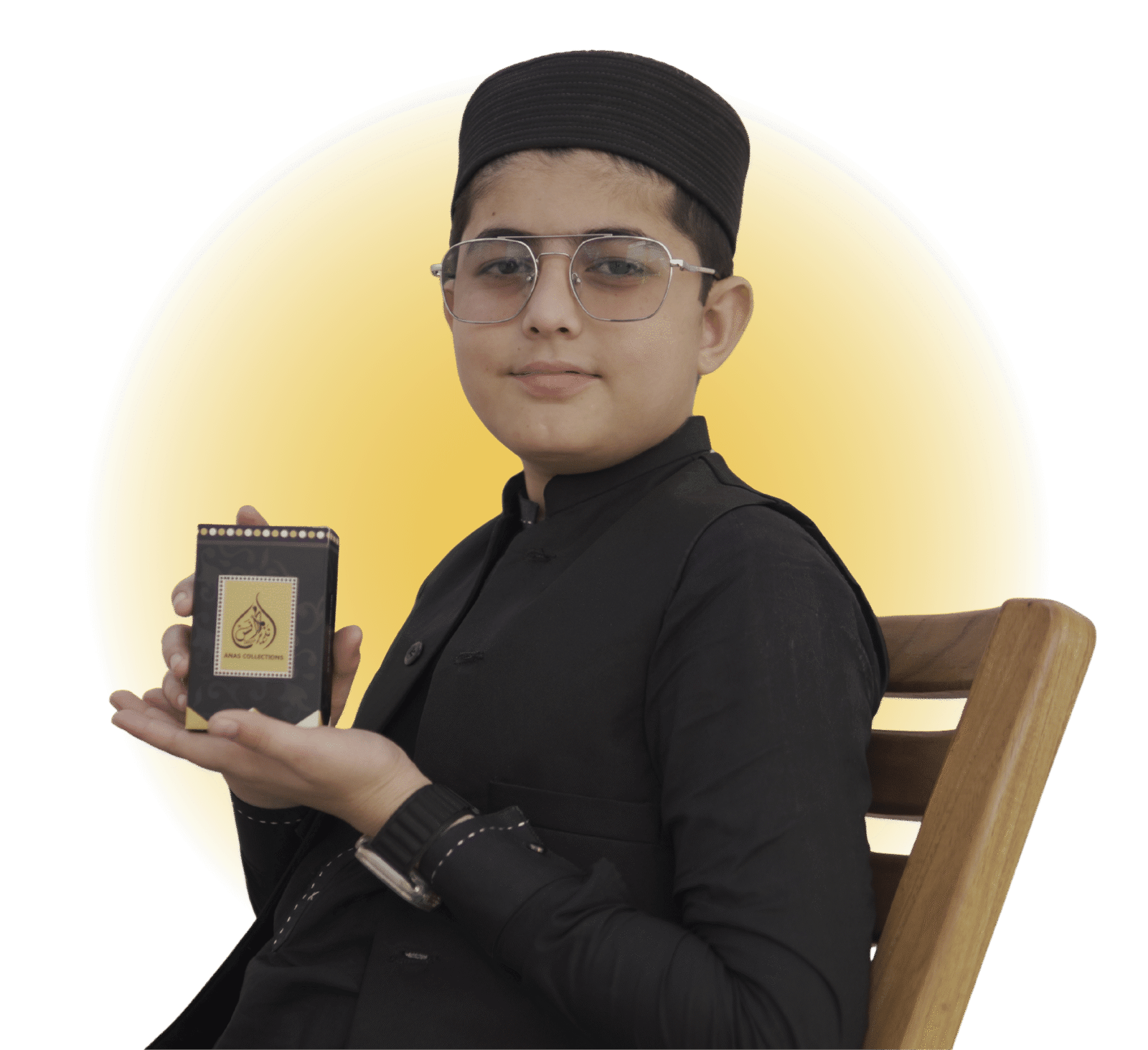 Muhammad Anas Nazeer holding a luxury Arabic perfume bottle - Best long-lasting attars and fragrances in Pakistan by Anas Collectionz